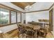 Spacious dining room with beautiful hardwood floors, wood trim, and plenty of natural light at 7741 Long Branch Dr, Indianapolis, IN 46259