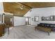 Bright living room featuring a wood-paneled ceiling, carpeted floors, and comfortable seating at 7741 Long Branch Dr, Indianapolis, IN 46259