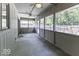 Enclosed porch featuring multiple screened windows and two ceiling fans at 7741 Long Branch Dr, Indianapolis, IN 46259