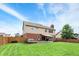 Expansive backyard showcasing a well-kept lawn, patio, and house exterior providing a private outdoor retreat at 8030 Parcrest Ct, Indianapolis, IN 46259
