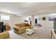 Finished basement with sitting area, fitness equipment, desk, and neutral walls offering versatile living space at 8030 Parcrest Ct, Indianapolis, IN 46259