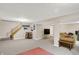 Spacious finished basement with stairs, TV, seating, and neutral paint offering versatile space and potential living area at 8030 Parcrest Ct, Indianapolis, IN 46259