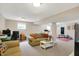 Finished basement area with seating, fitness equipment, a desk, and neutral walls, offering versatile space at 8030 Parcrest Ct, Indianapolis, IN 46259