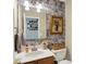 Decorated half bath with wallpaper and modern fixtures at 8030 Parcrest Ct, Indianapolis, IN 46259