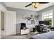 Bright bedroom featuring a functional workstation, natural light, and neutral gray color scheme, creating a productive atmosphere at 8030 Parcrest Ct, Indianapolis, IN 46259