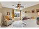 Cozy Bedroom with a white crib, comfy recliner, and bright yellow accents at 8030 Parcrest Ct, Indianapolis, IN 46259