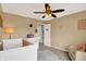 Neutrally decorated Bedroom with a white crib, comfortable seating, and ample space at 8030 Parcrest Ct, Indianapolis, IN 46259