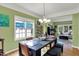 Open dining room with large window and view to the living room at 8030 Parcrest Ct, Indianapolis, IN 46259