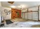 A clean and well-organized two-car garage with a work area and space for storage at 8030 Parcrest Ct, Indianapolis, IN 46259
