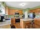 Well-lit kitchen with stainless appliances, a center island and breakfast bar at 8030 Parcrest Ct, Indianapolis, IN 46259