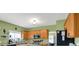 View of the kitchen with stainless appliances and breakfast bar area at 8030 Parcrest Ct, Indianapolis, IN 46259