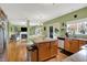 Bright kitchen with island and view of the open-plan living room at 8030 Parcrest Ct, Indianapolis, IN 46259