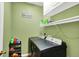 Functional laundry room with a modern washer and dryer, shelving, and ample storage space for laundry essentials at 8030 Parcrest Ct, Indianapolis, IN 46259