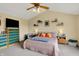 Comfortable main bedroom with ceiling fan, side tables, and a spacious feel at 8030 Parcrest Ct, Indianapolis, IN 46259