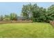 Expansive backyard featuring a lush lawn and privacy fence at 8140 Springwater W Dr, Indianapolis, IN 46256
