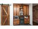 Bar area with built in storage, wine cooler, and microwave makes for great entertaining at 8140 Springwater W Dr, Indianapolis, IN 46256