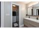 Modern bathroom featuring double sink vanity, modern lighting, and a large walk-in shower with glass doors at 8140 Springwater W Dr, Indianapolis, IN 46256