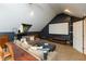 Inviting bonus room featuring a large screen and comfortable couches and seating at 8140 Springwater W Dr, Indianapolis, IN 46256