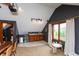 Bonus room featuring a convenient wet bar, mini fridge and ample lighting at 8140 Springwater W Dr, Indianapolis, IN 46256