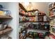 Walk-in pantry features multiple shelves for ample storage of food and kitchen accessories at 8140 Springwater W Dr, Indianapolis, IN 46256