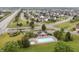 Aerial view of community pool with lounge chairs and tables at the Landings at Sugarcreek community at 8663 N Commonview Dr, McCordsville, IN 46055