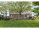 Spacious backyard with a deck, well-maintained lawn, and mature landscaping at 8663 N Commonview Dr, McCordsville, IN 46055