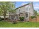 Spacious backyard with a deck, well-maintained lawn, and mature landscaping at 8663 N Commonview Dr, McCordsville, IN 46055