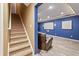 Finished basement leading to a staircase and a theater area with a projector screen and comfy seating at 8663 N Commonview Dr, McCordsville, IN 46055