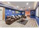 Finished basement featuring a projector screen, billiards room, and ample seating for entertainment at 8663 N Commonview Dr, McCordsville, IN 46055