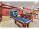 Basement with a pool table, bar area, and comfortable seating, perfect for entertaining guests at 8663 N Commonview Dr, McCordsville, IN 46055