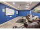 Finished basement with a large screen, projector, and comfortable seating area, perfect for movie nights at 8663 N Commonview Dr, McCordsville, IN 46055