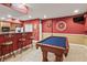 Basement with a pool table, bar area, and dart board, perfect for entertaining guests at 8663 N Commonview Dr, McCordsville, IN 46055