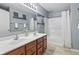 This bathroom offers a double vanity, and a shower/tub with modern fixtures and elegant decor at 8663 N Commonview Dr, McCordsville, IN 46055