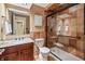 Bathroom with stone tiles, granite countertops, and a glass-enclosed shower at 8663 N Commonview Dr, McCordsville, IN 46055