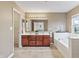 Well-lit bathroom with dual sink vanity, soaking tub, and lots of counter space at 8663 N Commonview Dr, McCordsville, IN 46055
