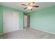Bedroom featuring neutral carpeting, closet space, and access to another room at 8663 N Commonview Dr, McCordsville, IN 46055