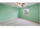 Comfortable bedroom with neutral carpeting, light green walls and a ceiling fan at 8663 N Commonview Dr, McCordsville, IN 46055