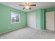 Bedroom with neutral carpeting, closet and large window allowing natural light to flood the room at 8663 N Commonview Dr, McCordsville, IN 46055