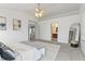 Inviting bedroom with a cozy bed and views into the hallway and en-suite bathroom at 8663 N Commonview Dr, McCordsville, IN 46055