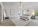 Bright main bedroom with vaulted ceiling, ceiling fan, and sun-drenched windows at 8663 N Commonview Dr, McCordsville, IN 46055