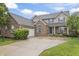 Charming two-story brick home with an attached garage and well-manicured lawn boasts inviting curb appeal at 8663 N Commonview Dr, McCordsville, IN 46055