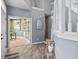 Bright foyer with beautiful staircase, light wood floors, and an adjacent office space, creating a stylish entryway at 8663 N Commonview Dr, McCordsville, IN 46055