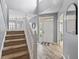 Bright, spacious foyer with beautiful staircase featuring stylish light wood floors and a soaring ceiling at 8663 N Commonview Dr, McCordsville, IN 46055