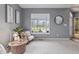 Bright living room with carpet, natural light, and neutral color scheme provides a calm, inviting space at 8663 N Commonview Dr, McCordsville, IN 46055