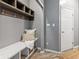 Well-organized mudroom with bench, overhead storage, and hooks offers practical space for entry essentials at 8663 N Commonview Dr, McCordsville, IN 46055