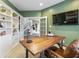 Inviting home office with custom built-ins, wood desk, and wall-mounted TV for productive work at 8663 N Commonview Dr, McCordsville, IN 46055