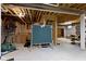 Unfinished basement with exposed ceiling, pool table, a dart board and gym equipment at 9175 Lakewind Dr, Indianapolis, IN 46256