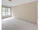 Bright bedroom with large windows, neutral carpet, and a ceiling fan at 9175 Lakewind Dr, Indianapolis, IN 46256