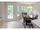 Breakfast nook featuring large windows and a wooden table with chairs at 9175 Lakewind Dr, Indianapolis, IN 46256