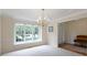 Dining room area featuring light paint, trim details, and a large window at 9175 Lakewind Dr, Indianapolis, IN 46256